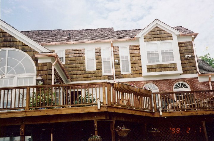 A brick house with a large porch