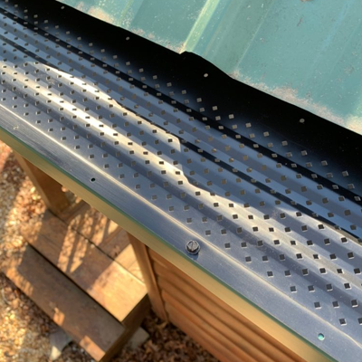 A metal gutter guard